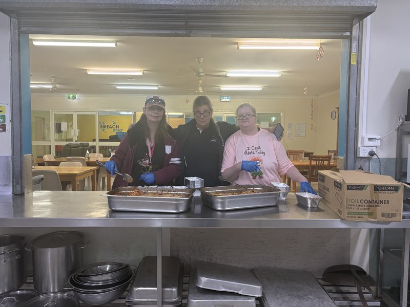 INREACH team preparing meals in kitchen