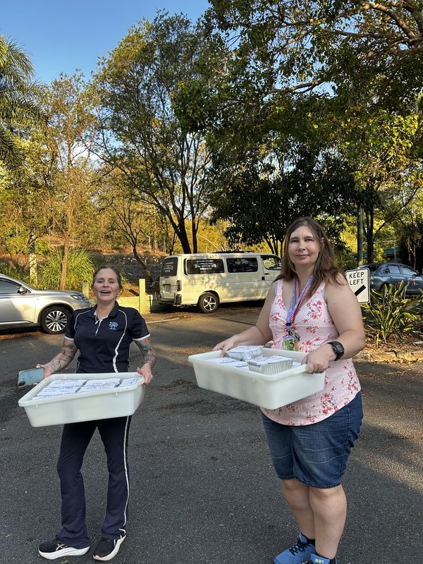 Team members delivering meals for Give Back Thursday